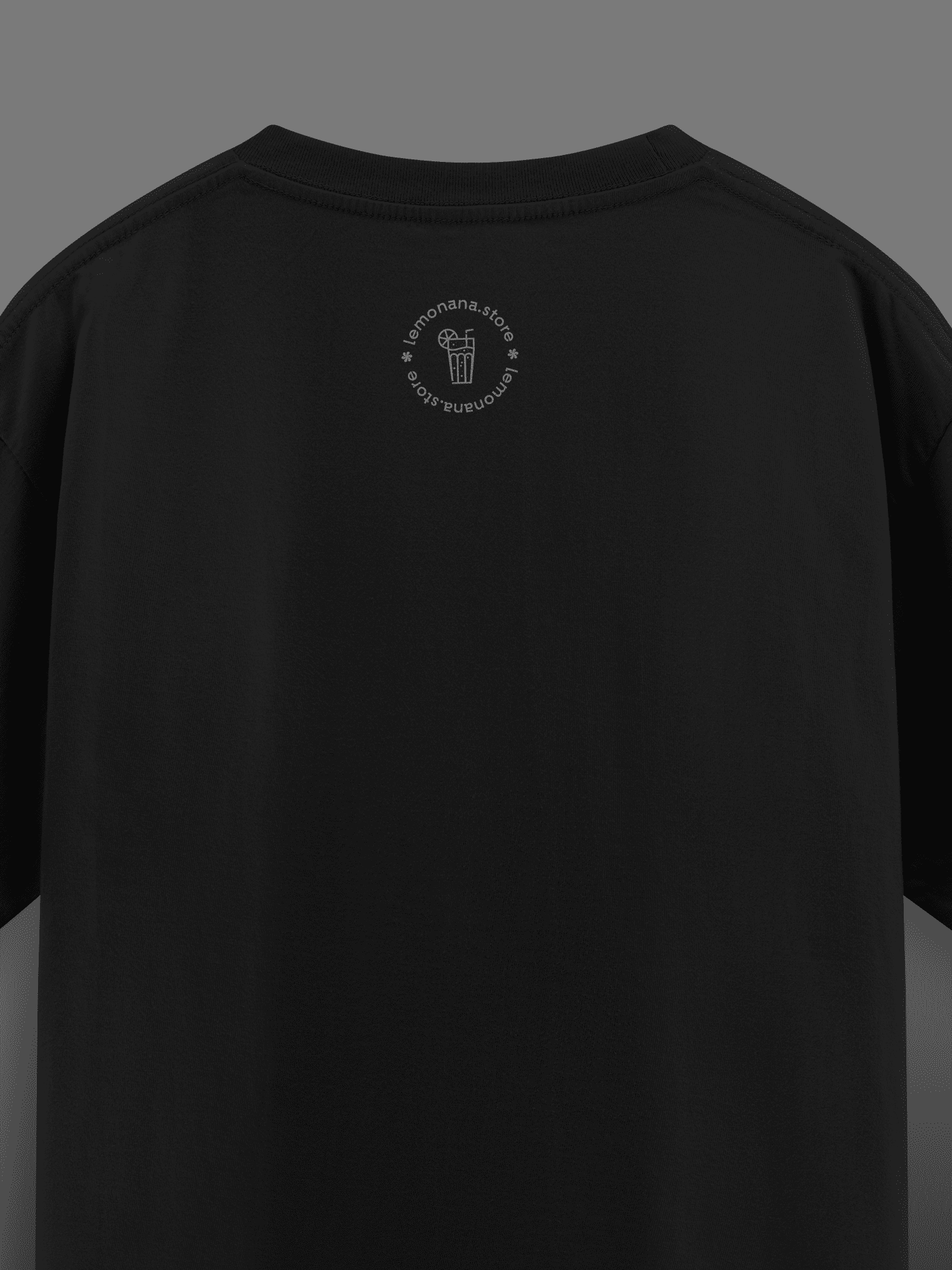 Black t-shirt with a small logo on the chest against a dark background
