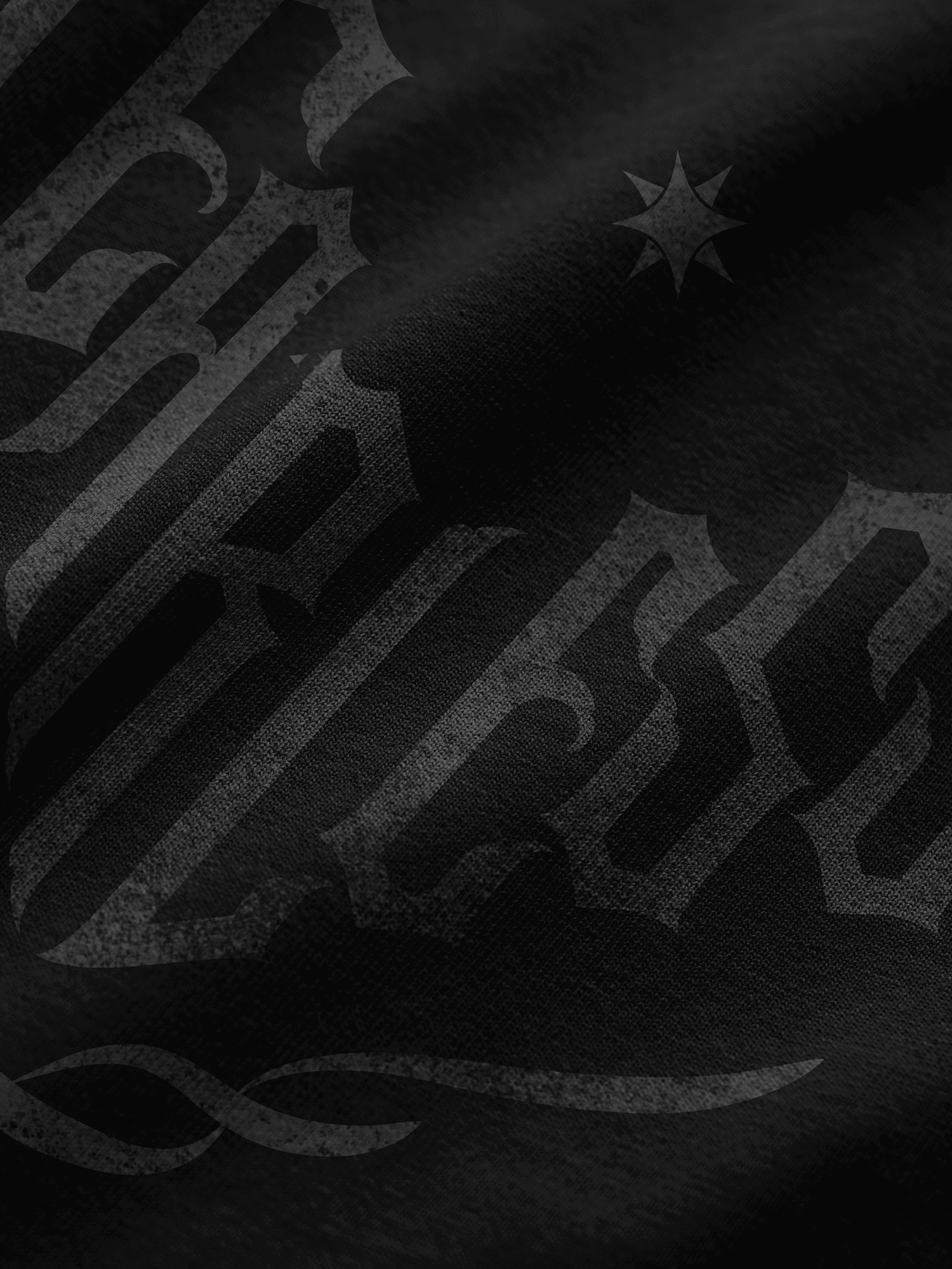 Black textured fabric with star and text design