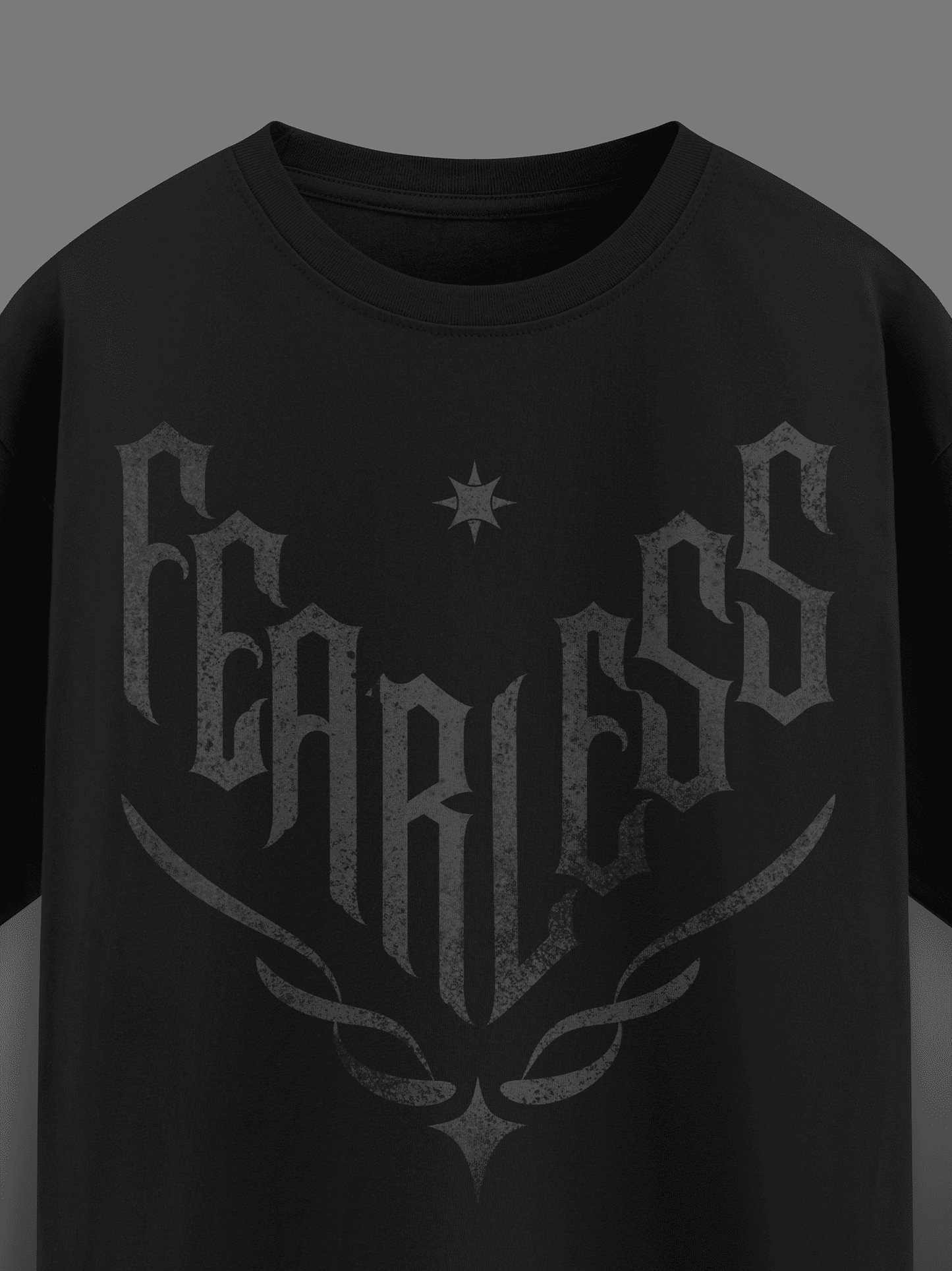 Black t-shirt with 'FEARLESS' printed in a stylized font on a dark background
