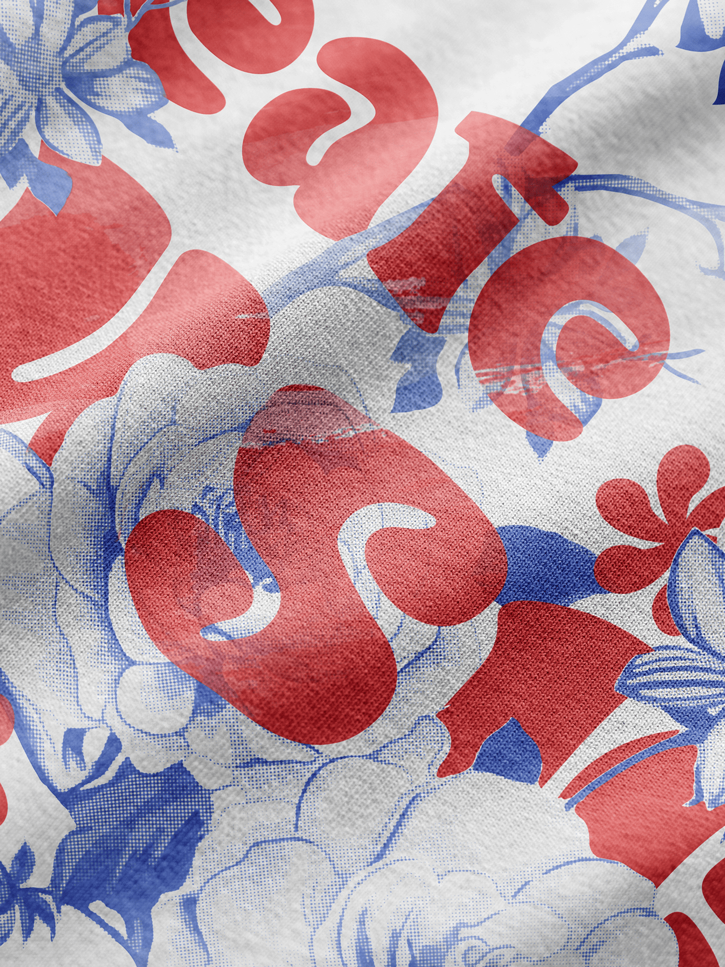 Close-up of a fabric with red, blue, and white floral pattern