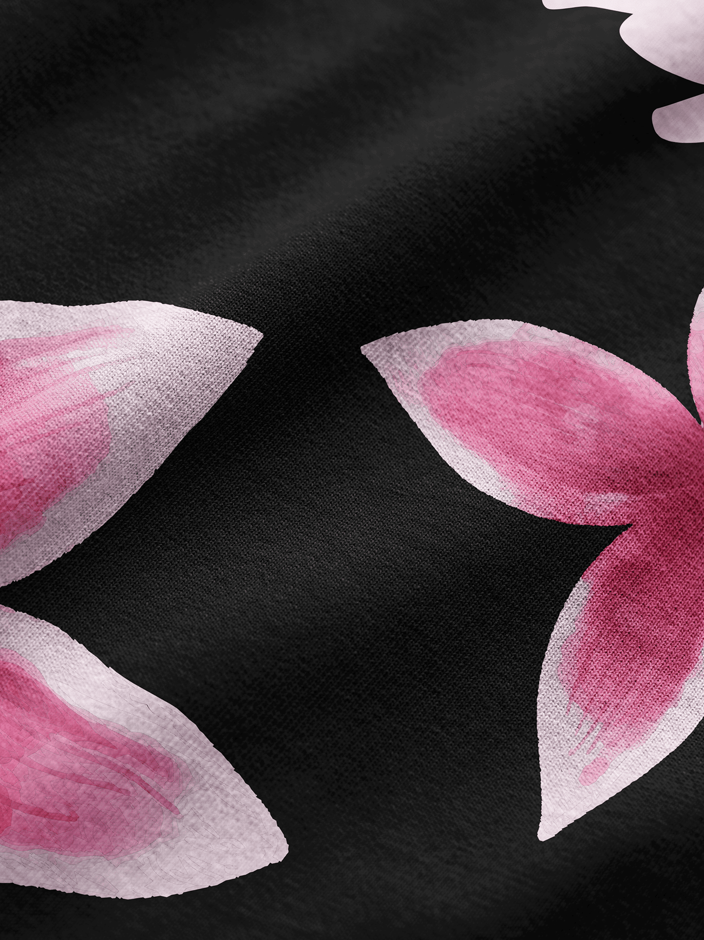 Pink flower petals on a black background
