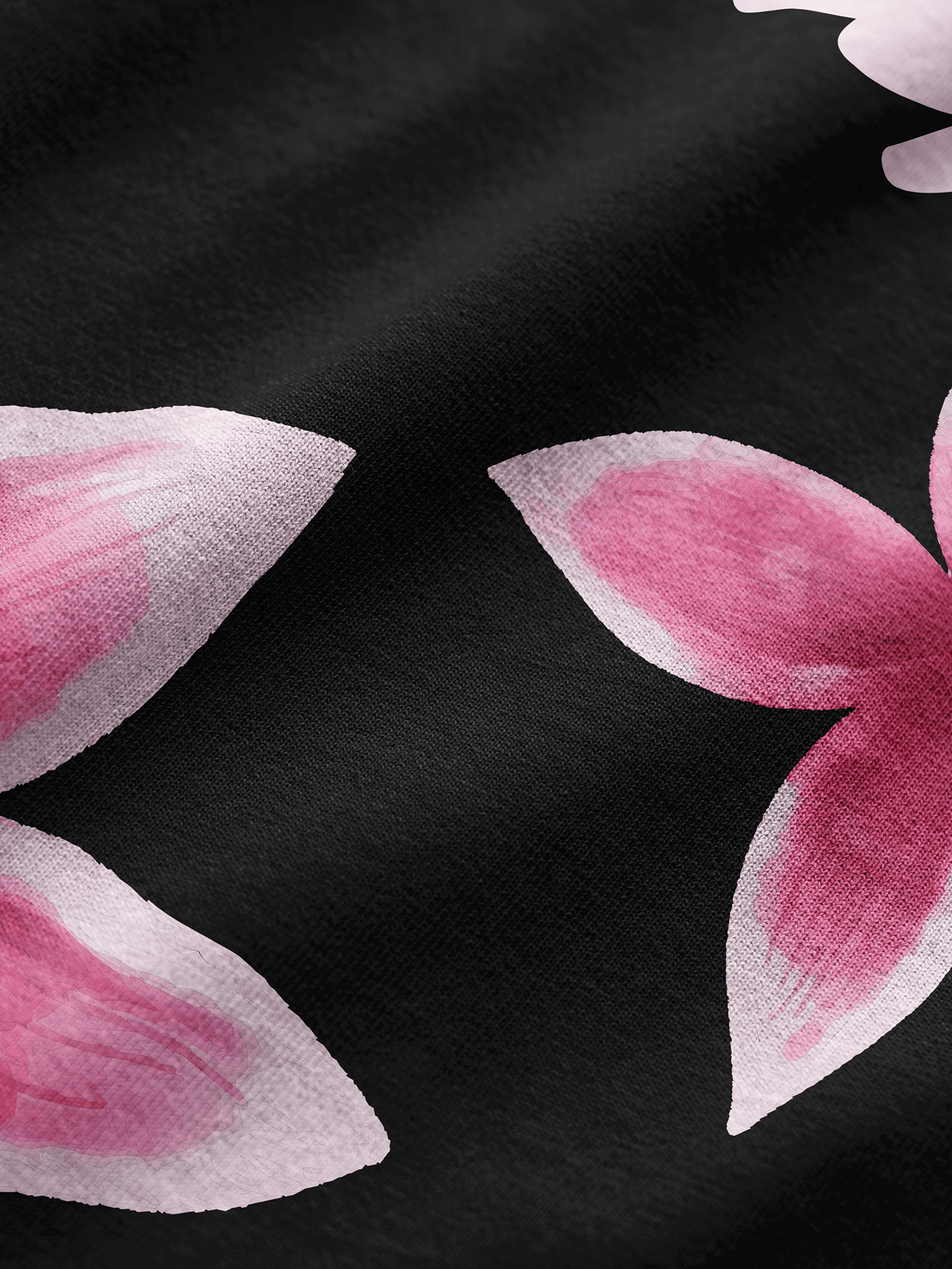 Pink flower petals on a black background