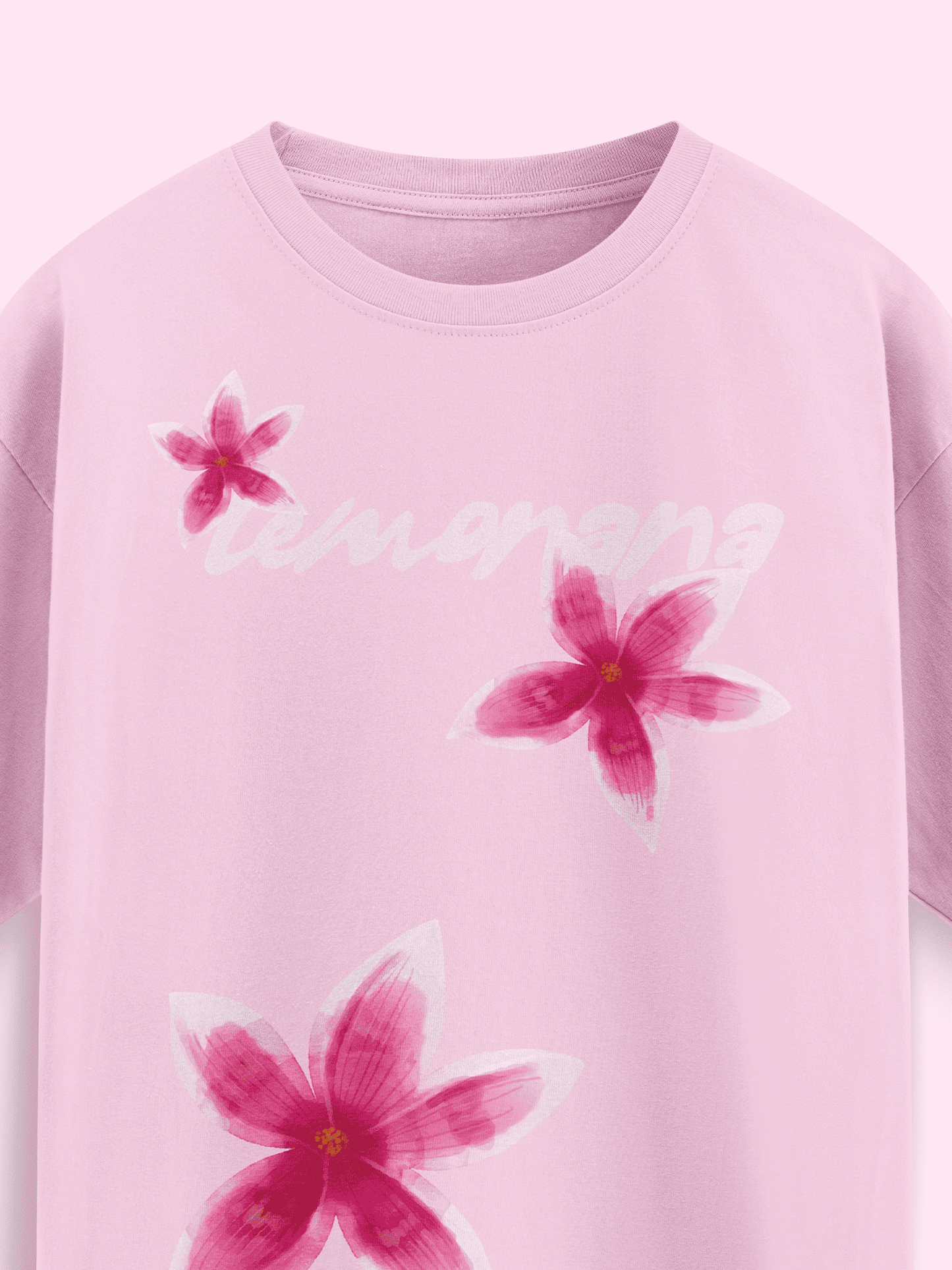 Pink sweatshirt with floral designs and 'Lemonana' text on a light pink background