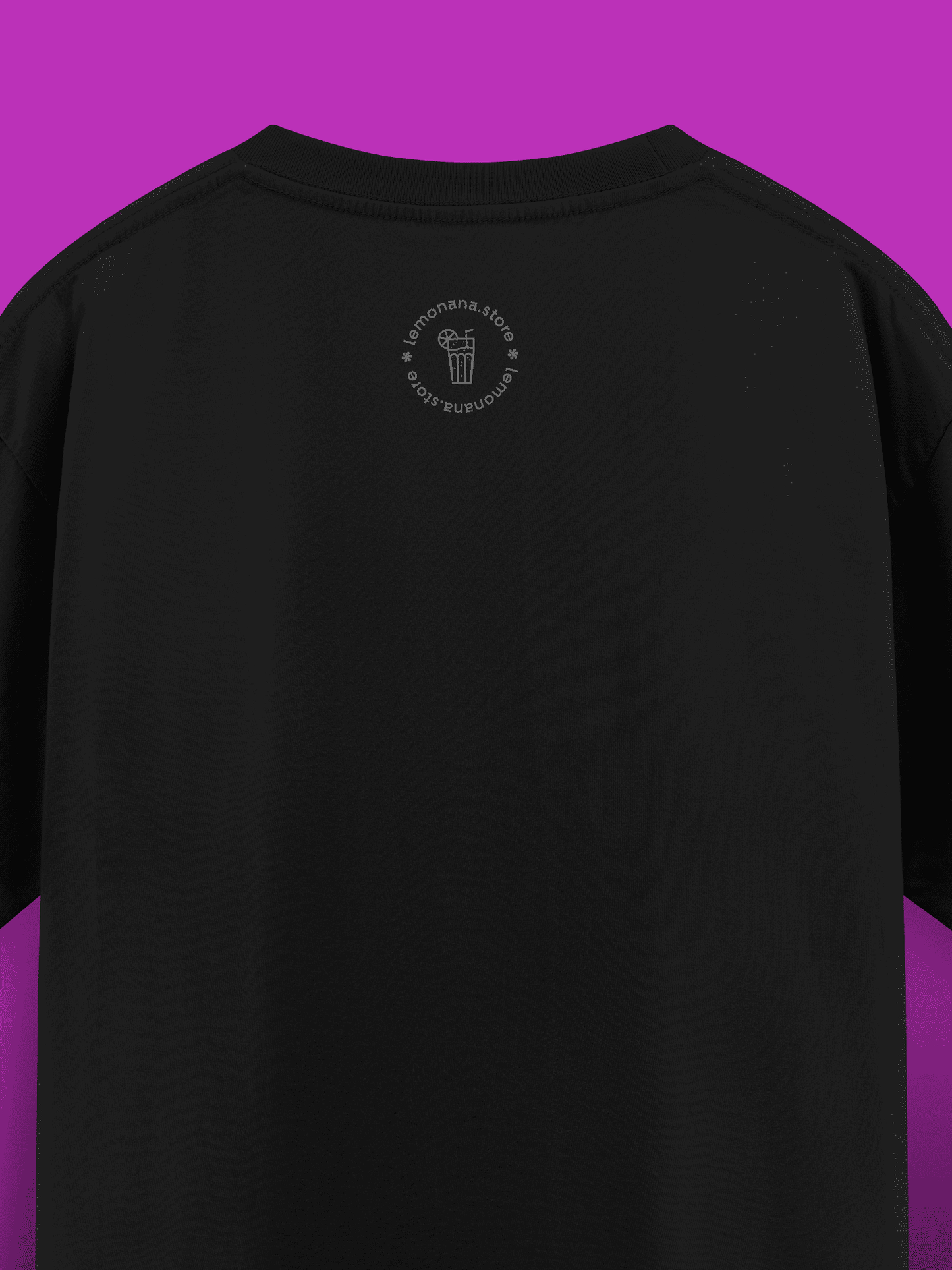 Black t-shirt with a small logo on the back against a purple background
