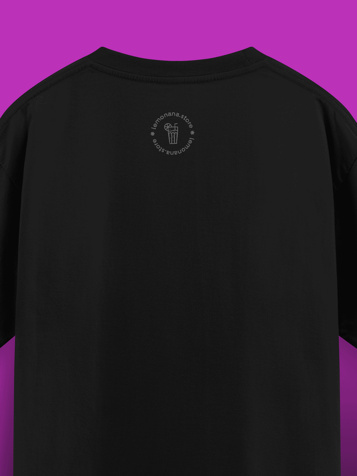 Black t-shirt with a small logo on the back against a purple background