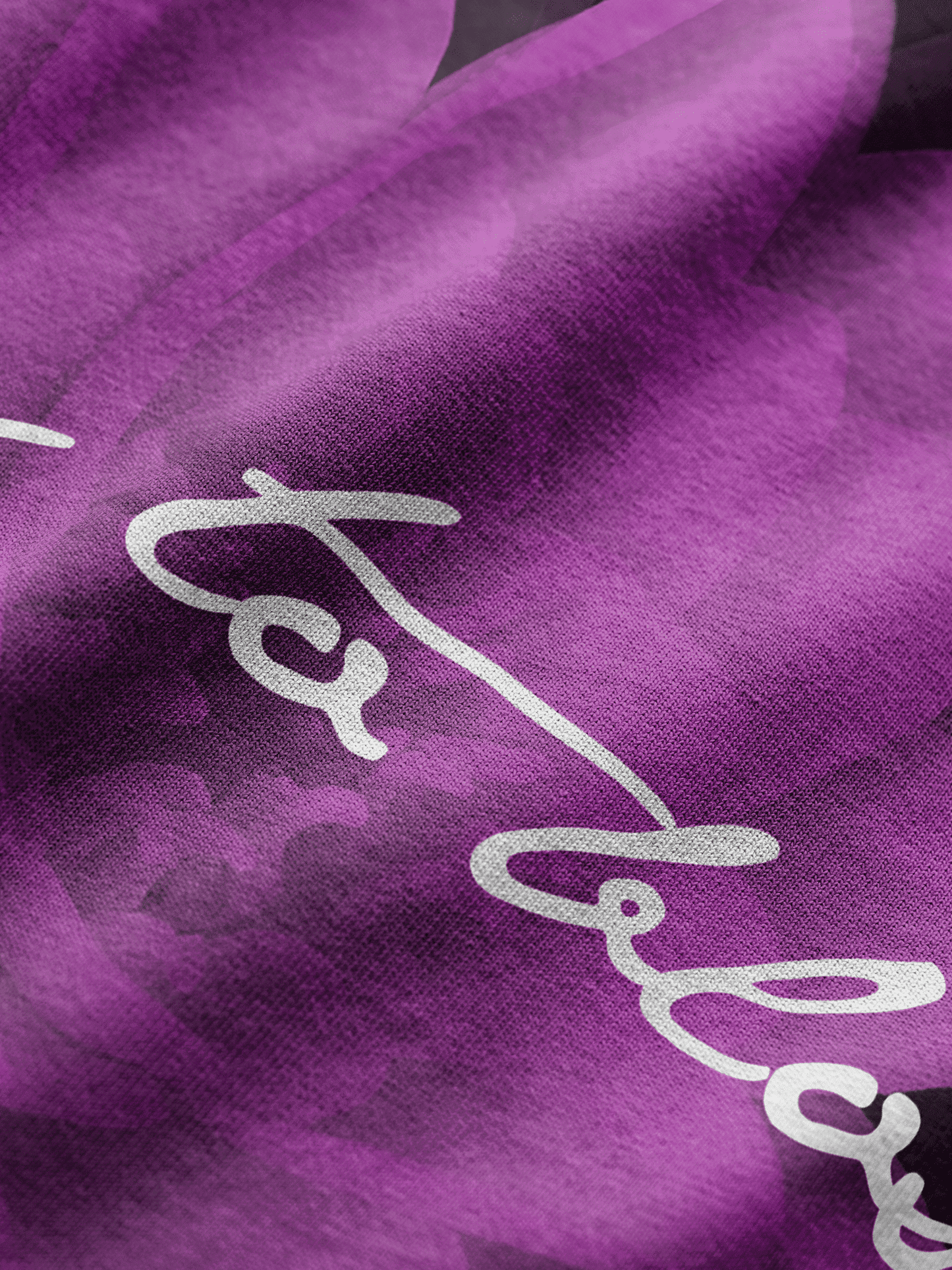 Close-up of a purple fabric with white text on it