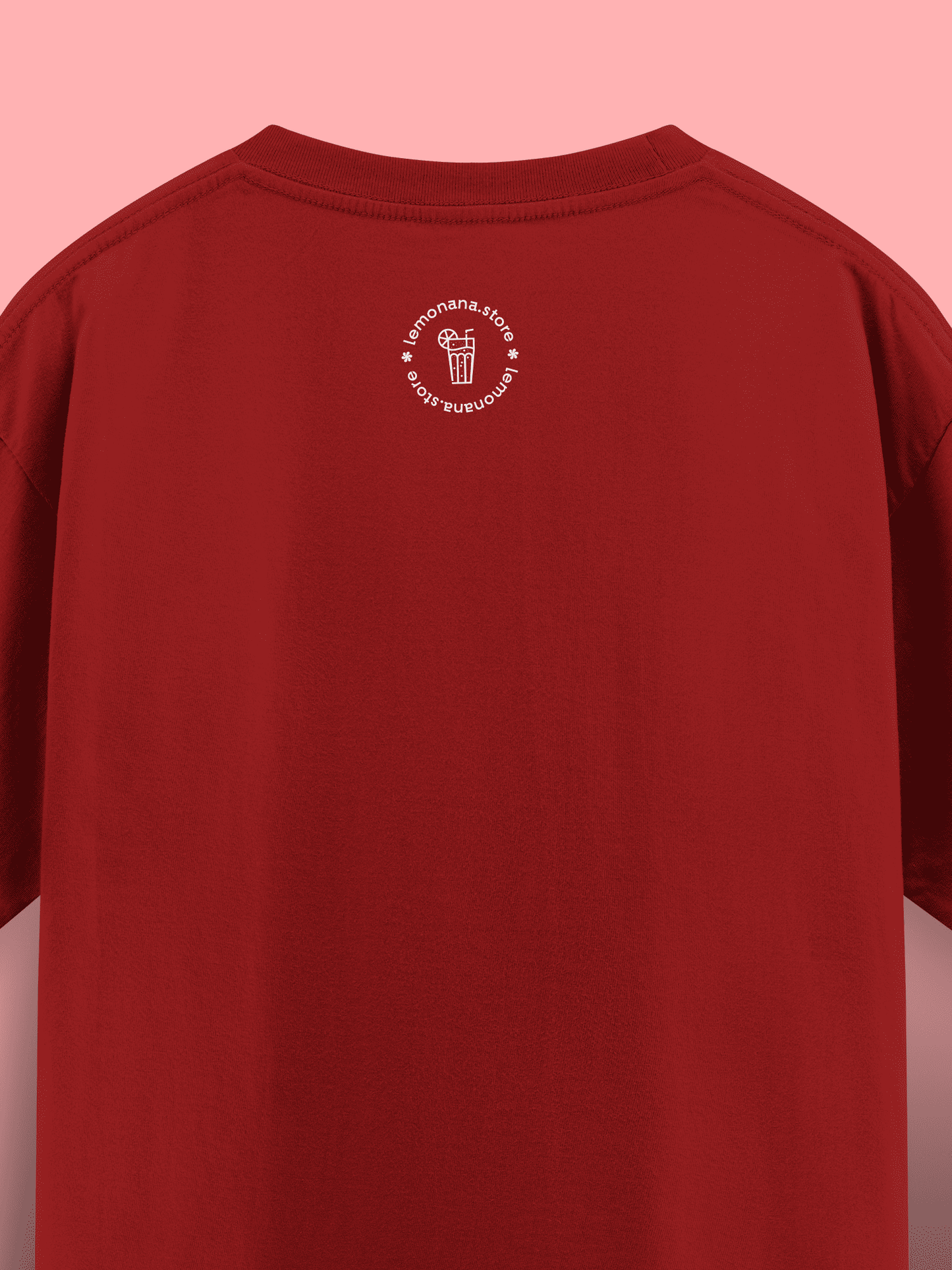 Red t-shirt with a white logo on the chest against a pink background