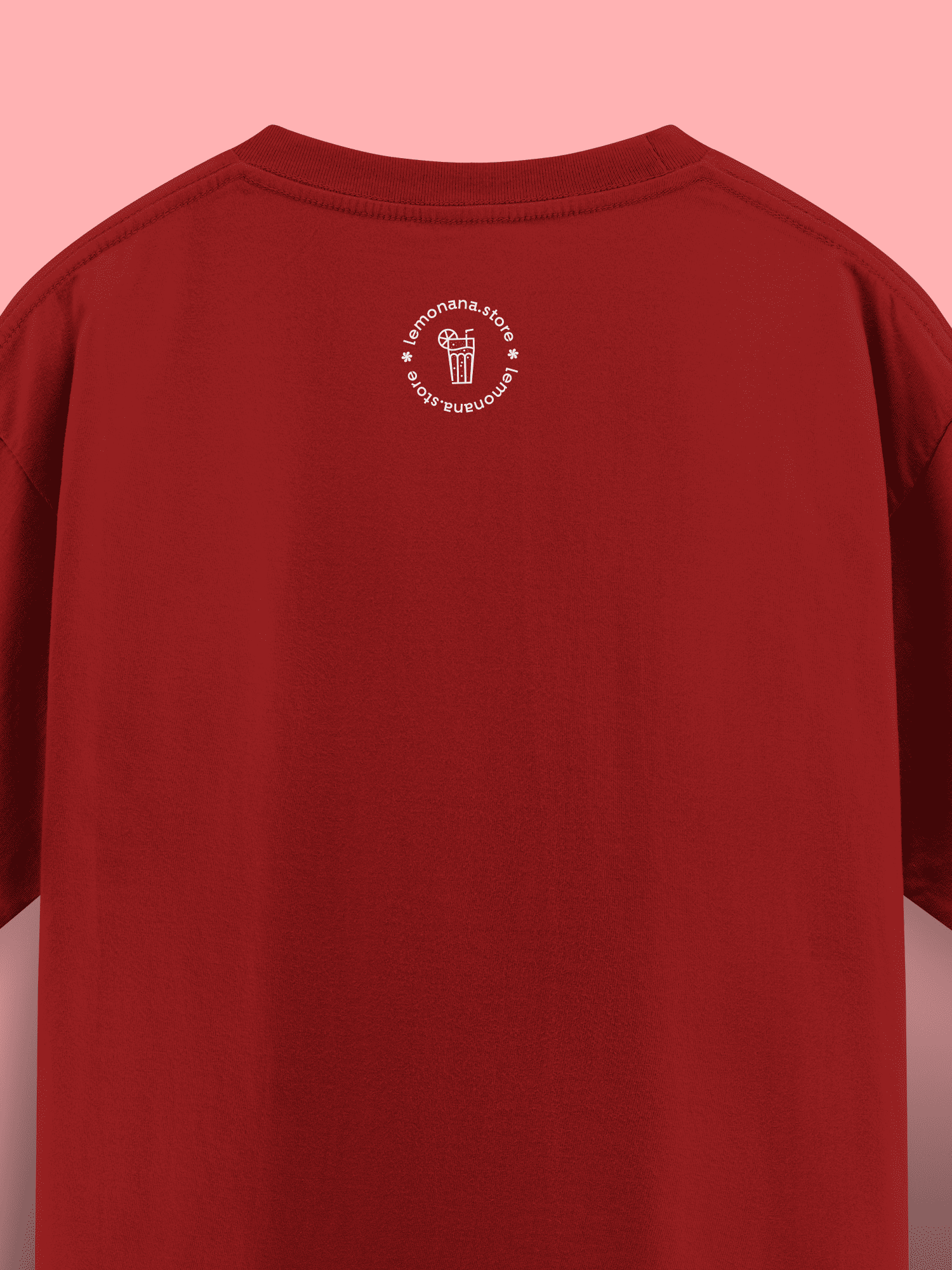 Red t-shirt with a white logo on the chest against a pink background