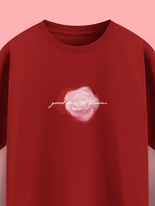 Red t-shirt with a pink flower graphic and text on a pink background