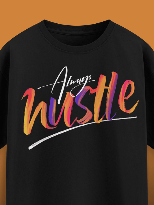 Black t-shirt with 'Always Hustle' text in colorful gradient on a brown background