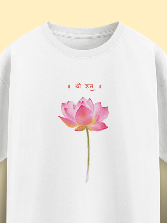 White t-shirt with a pink lotus flower design and red text on a yellow background