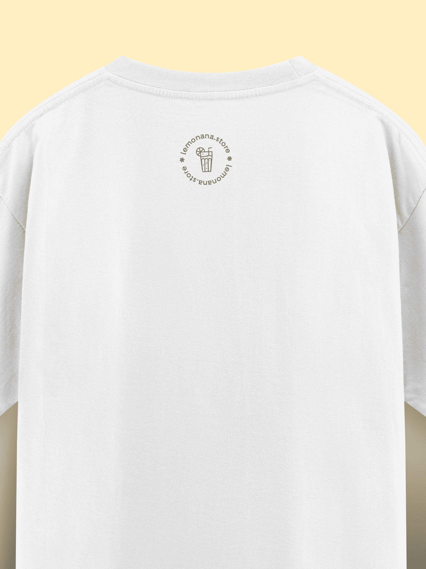 White t-shirt with a small logo on the chest against a yellow background