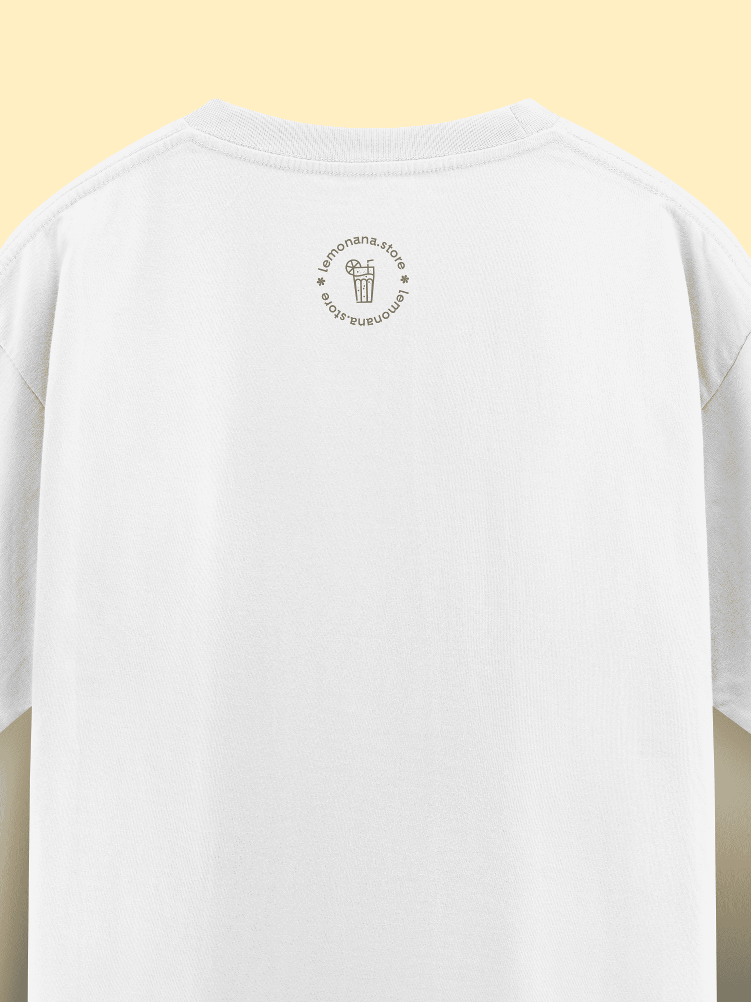 White t-shirt with a small logo on the chest against a yellow background