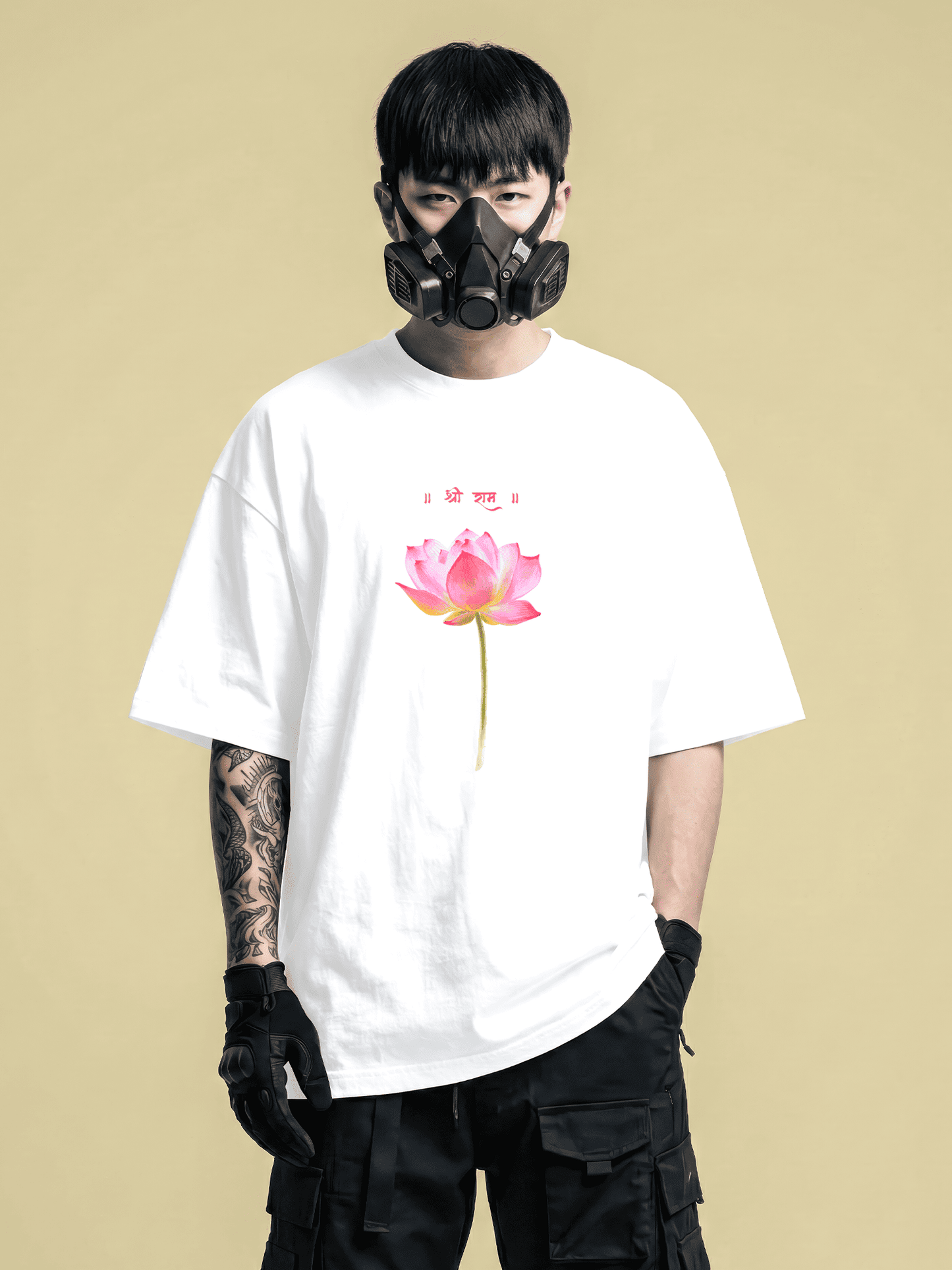 Person wearing a white t-shirt with a pink flower design on a beige background