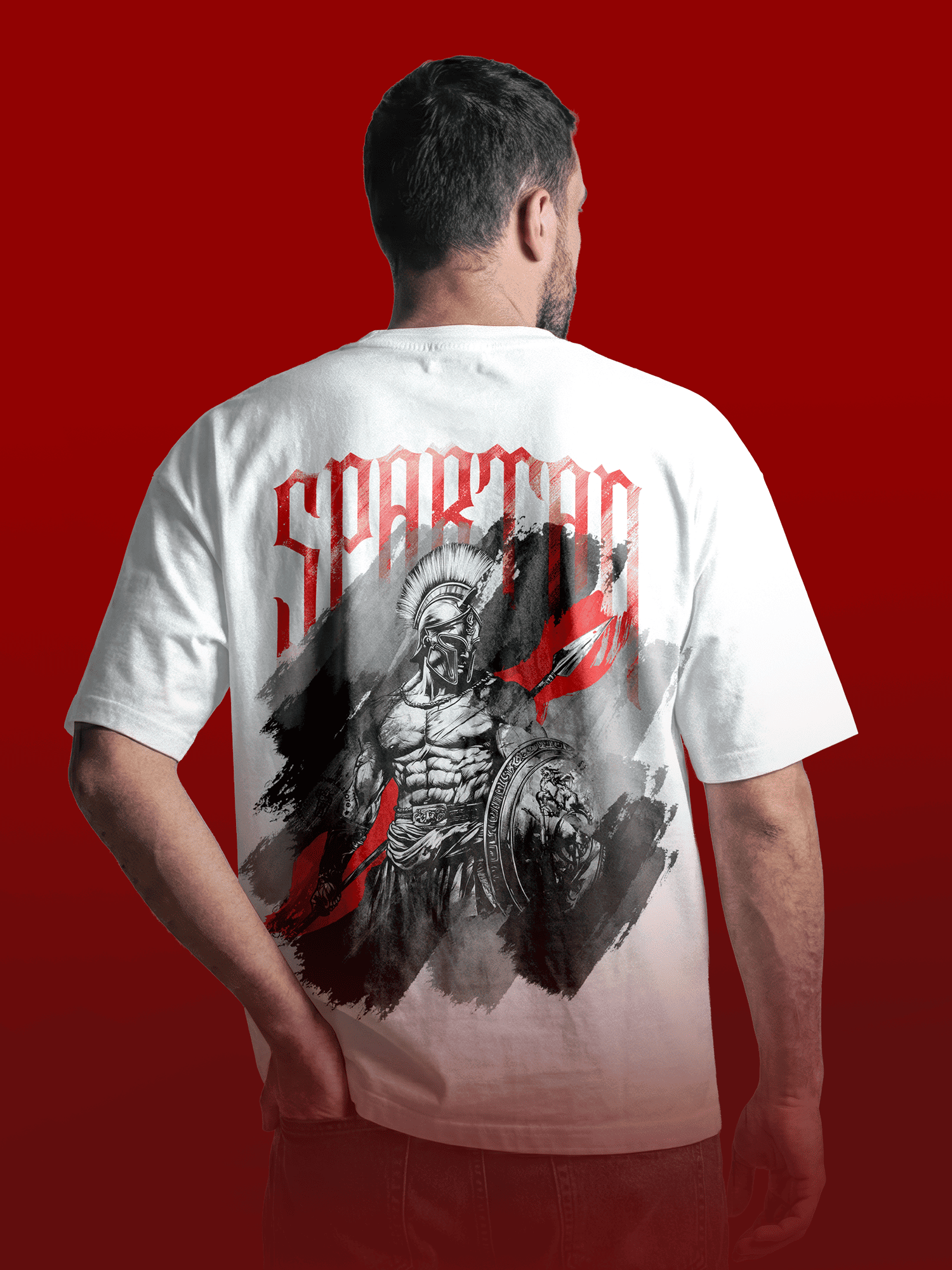 Person wearing a white t-shirt with 'Spartan' design on the back against a red background